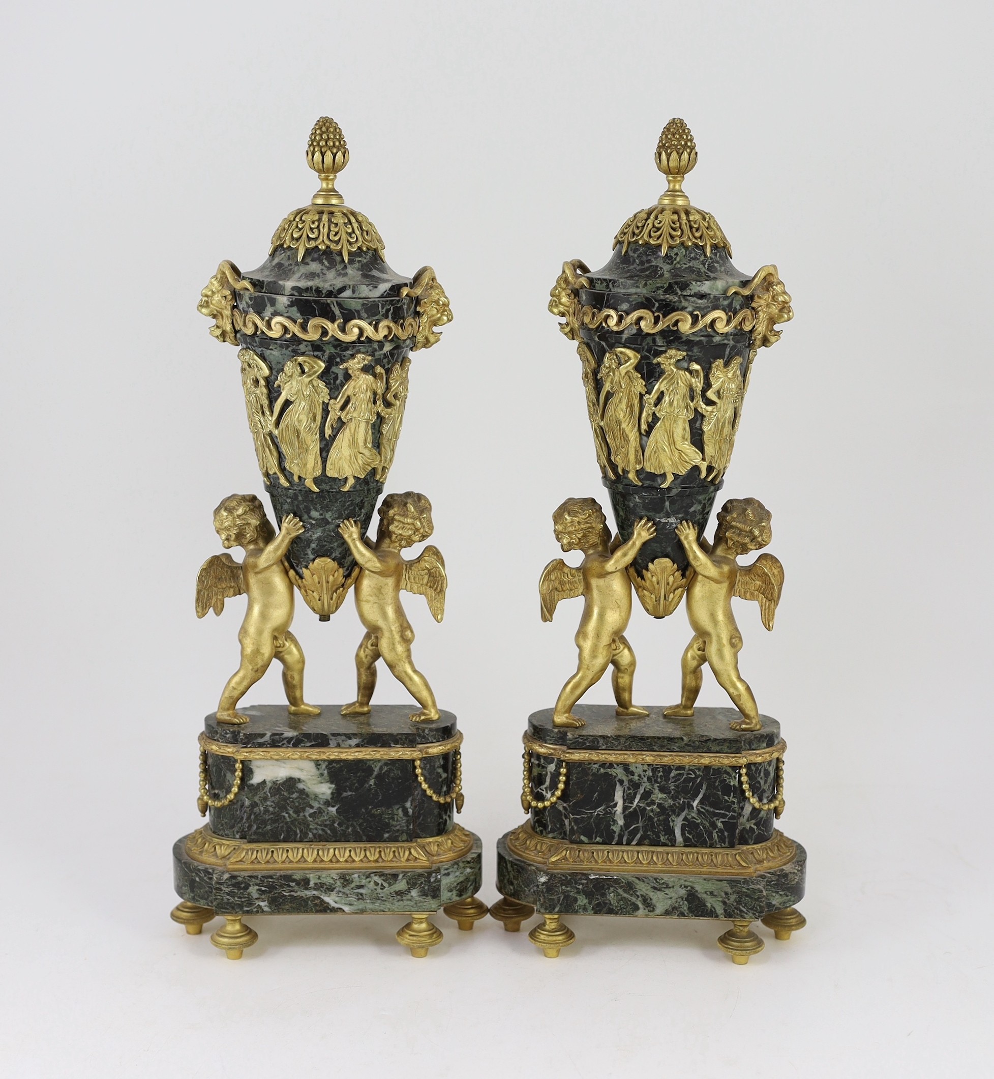 A pair of Louis XVI style ormolu mounted green marble urns Height 41cm.